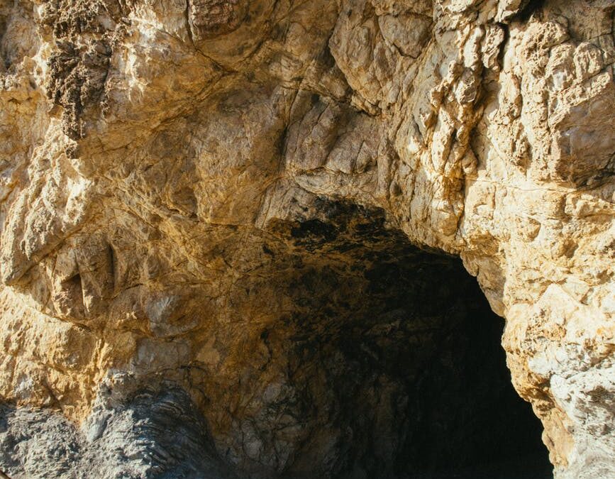 photo of cave during daytime
